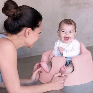 Pink bumbo floor seat with safety strap